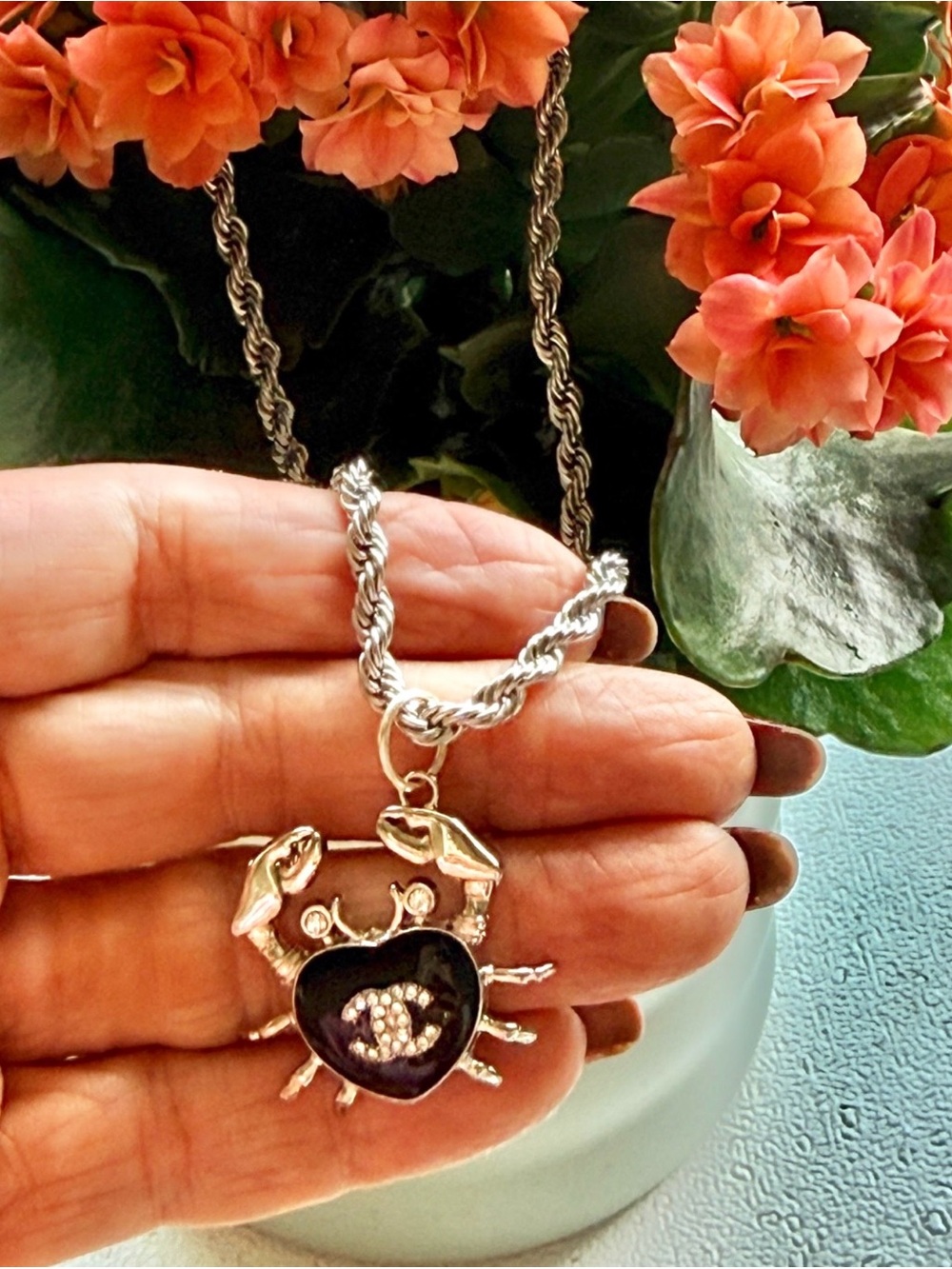 Chanel Silver-Tone stamped 
Crab in black enamel & Chrystal 
on 19" twist rope